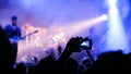 Hands silhouette recording video of live music concert with smartphone Royalty Free Stock Photo