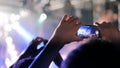 Hands silhouette recording video of live music concert with smartphone Royalty Free Stock Photo