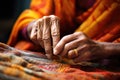 hands of a skilled weaver working on sari fabric