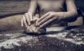Hands skillfully knead the dough