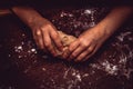 Hands skillfully knead the dough