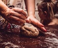 Hands skillfully knead the dough