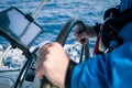 Hands of the skipper at the helm control of sailing boat Royalty Free Stock Photo
