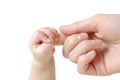 Hands of a small newborn baby hold on to fingers Royalty Free Stock Photo