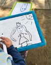 Hands of small student drawing on whiteboards Royalty Free Stock Photo