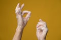 Hands in soapy foam, one of them shows a ok sign with her fingers. Concept for an effective way to prevent the spread of