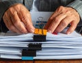 Hands Sorting Files with Colorful Paper Clips and Documents Royalty Free Stock Photo