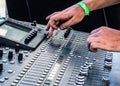 Hands on sound board adjusting levels