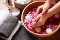 Hands spa, beautiful woman's hands in bowl of water