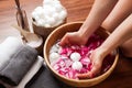 Hands spa, beautiful woman's hands in bowl of water