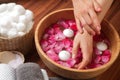 Hands spa, beautiful woman's hands in bowl of water