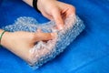 Hands that squeeze Bubble wrap for packaging. Antidepressants Royalty Free Stock Photo