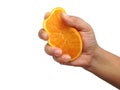 Hands are squeezing orange isolated on white background