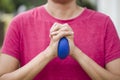 Hands squeezing a stress ball