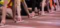 Hands at starting line on track and field Royalty Free Stock Photo