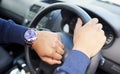 Hands, steering wheel and check watch for driver, travel schedule or traffic on street. Person, chauffeur or transport