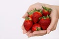 Hands with strawberries