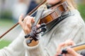 Hands of a street musician girl with violin close up Royalty Free Stock Photo