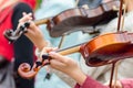 Hands of a street musician girl with violin close up Royalty Free Stock Photo