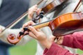 Hands of a street musician girl with violin close up Royalty Free Stock Photo