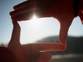 Hands stretch toward the sun on lake level Royalty Free Stock Photo