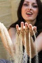 Hands strew sand Royalty Free Stock Photo