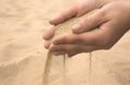 Hands strew sand Royalty Free Stock Photo