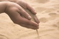 Hands strew sand Royalty Free Stock Photo