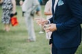 hands of stylish people cheering with glasses of champagne, luxury wedding reception, rich celebration. guests toasting at chris Royalty Free Stock Photo