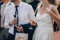hands of stylish people cheering with glasses of champagne, luxury wedding reception, rich celebration. guests toasting at chris Royalty Free Stock Photo