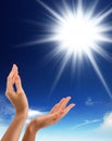 Hands, sun and blue sky with copy space Royalty Free Stock Photo