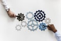 Hands with support gears isolated on white background Royalty Free Stock Photo