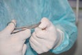 The hands of a surgeon during a surgical operation