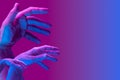 Hands in a surreal style in violet blue neon colors. Modern psychedelic creative element with human palm for posters