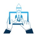 Hands with tablet device and startup rocket Royalty Free Stock Photo