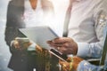 Hands, tablet and overlay of business people with phone for research, planning and brainstorming ideas. Technology, city Royalty Free Stock Photo