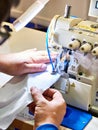 Hands of tailor and sewing machine Royalty Free Stock Photo
