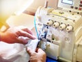 Hands of tailor and sewing machine Royalty Free Stock Photo