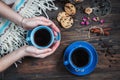 Hands take cup of coffee, coffee beans and cookies-hearts Royalty Free Stock Photo