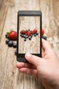 Hands Taking Photo Of Fruits On Wooden.