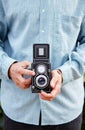 Hands taking photo with TLR camera Royalty Free Stock Photo