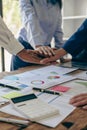 The hands of a team of businessmen joining forces celebrate the concept of unity. A close-up photo of a team working