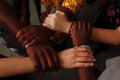 Hands of the team of happy group of African Latin American and European people which stay together in circle Royalty Free Stock Photo