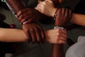 Hands of the team of happy group of African Latin American and European people which stay together in circle Royalty Free Stock Photo