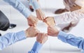 Closeup view businesspeople standing in circle fists bumping showing unity Royalty Free Stock Photo