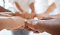 Hands, teamwork and motivation with a team of business people joining their fists in a huddle or circle. Collaboration Royalty Free Stock Photo