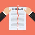 Hands tearing apart contract document paper