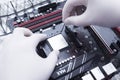 Hands of a technician assembling computer hardware parts new cpu is being mounted unto the motherboard Royalty Free Stock Photo