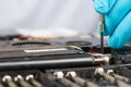 Hands of a technician repairing a broken laptop computer Royalty Free Stock Photo