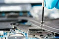 Hands of a technician repairing a broken laptop computer Royalty Free Stock Photo